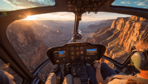 A pilot's-eye view from the cockpit of a helicopter soaring over the Grand Canyon at sunset, with passengers visible in the foreground, showcasing the scenic expertise and unforgettable experience provided by tour pilots.

